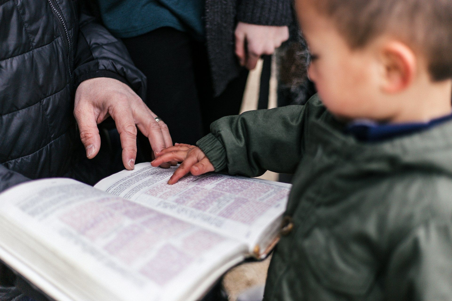 kid reading the Bible